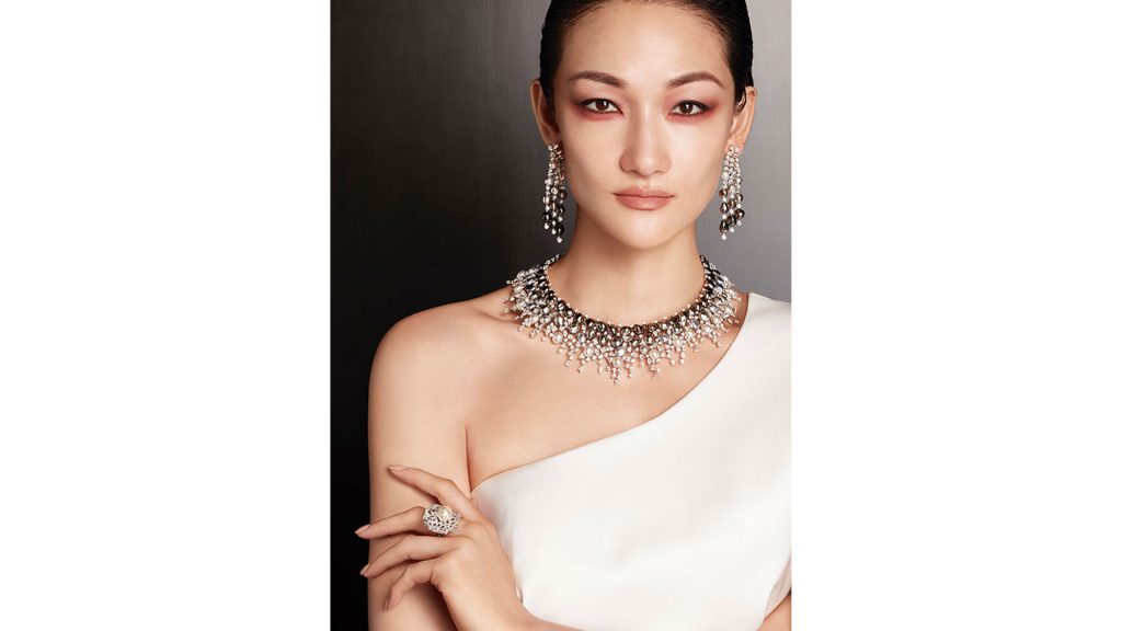 Japanese supermodel Ai Tominaga wears jewels in 18k white gold with akoya pearls, tourmalines, diamonds, and mother-of-pearl.